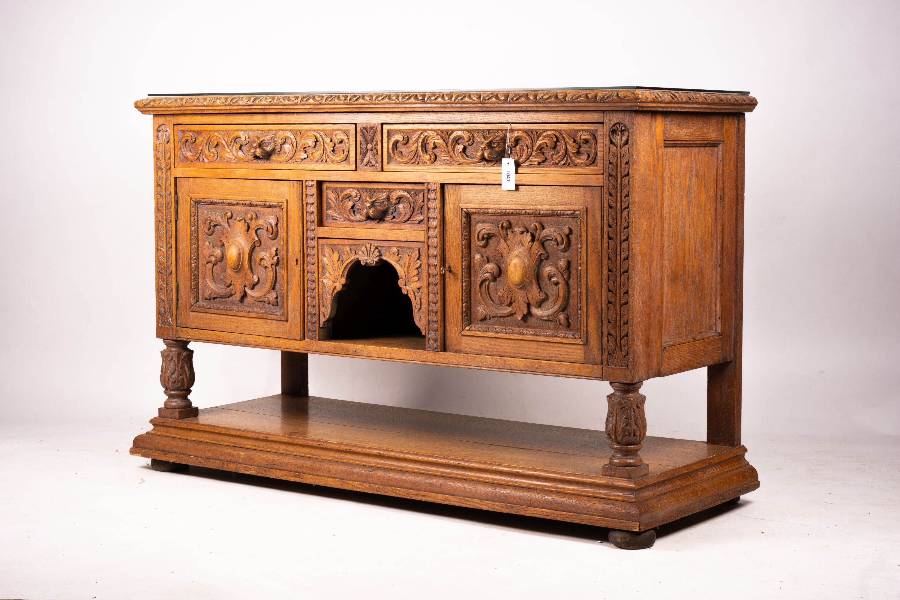 A late 19th century Flemish carved oak buffet, length 158cm, depth 58cm, height 99cm